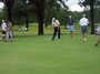 Putting begins on the first hole.